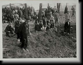Women and children waiting in a small wooded area near Crematorium IV * 380 x 290 * (27KB)